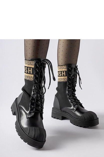 Elegant Solea black sock boots featuring a brown Daria inscription, ideal for women seeking stylish and comfortable footwear.