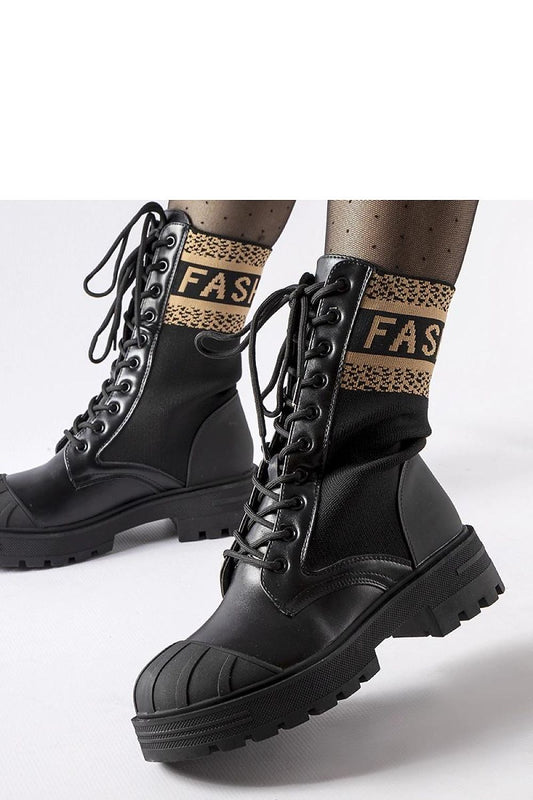 Luxurious Solea black sock boots showcasing their fitted design and laced details, perfect for various occasions.