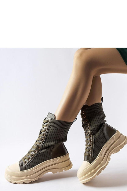 High-quality dark green Vitto ankle boots by Solea, showcasing a durable rubber sole and stylish lacing, ideal for adding a touch of elegance to any wardrobe.