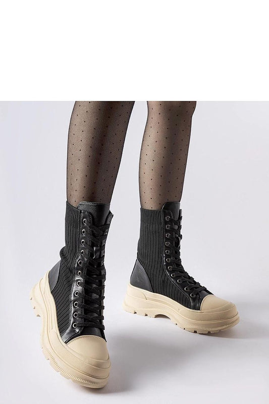 Close-up view of Solea black sock boots highlighting the high-quality materials and delicate round toe design, ideal for a luxurious look.