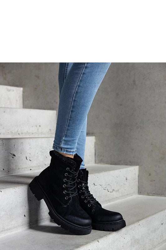 Luxury black ankle boots with shiny inserts from Solea, crafted in eco-leather for elegance and comfort.