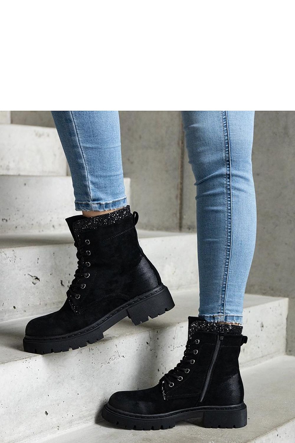 Luxury black ankle boots with shiny inserts by Solea, crafted from eco-leather, featuring a rounded toe and convenient zipper closure.