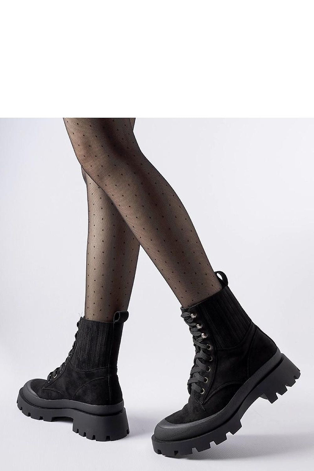 Side profile of Solea Black Orson eco-suede ankle boots, highlighting the refined silhouette and low heel, ideal for both casual and formal occasions.