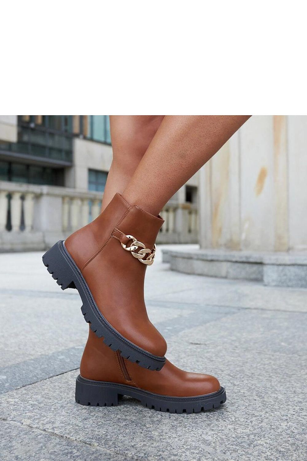 Stylish Brown Vegan Leather Ankle Boots with Chain Detail by Solea, perfect for winter fashion, featuring a comfortable flat heel and practical zipper.