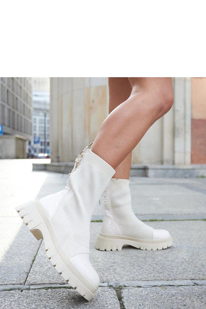 Solea Albertina beige patent leather ankle boots showcasing elegant sock-style design, perfect for sophisticated autumn-winter looks.