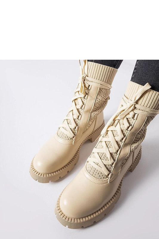 Close-up of Solea beige lace-up ankle boots, featuring high-quality eco leather, flat heel, and sophisticated lacy construction, ideal for comfort and chic style.