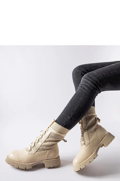 Side view of Solea's beige lace-up ankle boots, designed for women, combining comfort with a fashionable look suitable for casual and formal events.