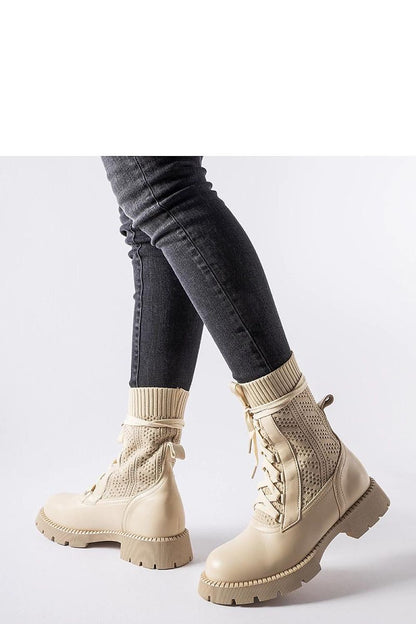 Solea beige lace-up ankle boots displayed elegantly, highlighting the delicate lacy texture and high ankle for warmth, perfect for the fall/winter season.