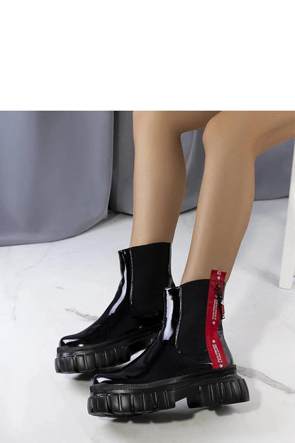 Solea luxury black patent leather Casta ankle boots showcasing elegant design and premium quality craftsmanship.
