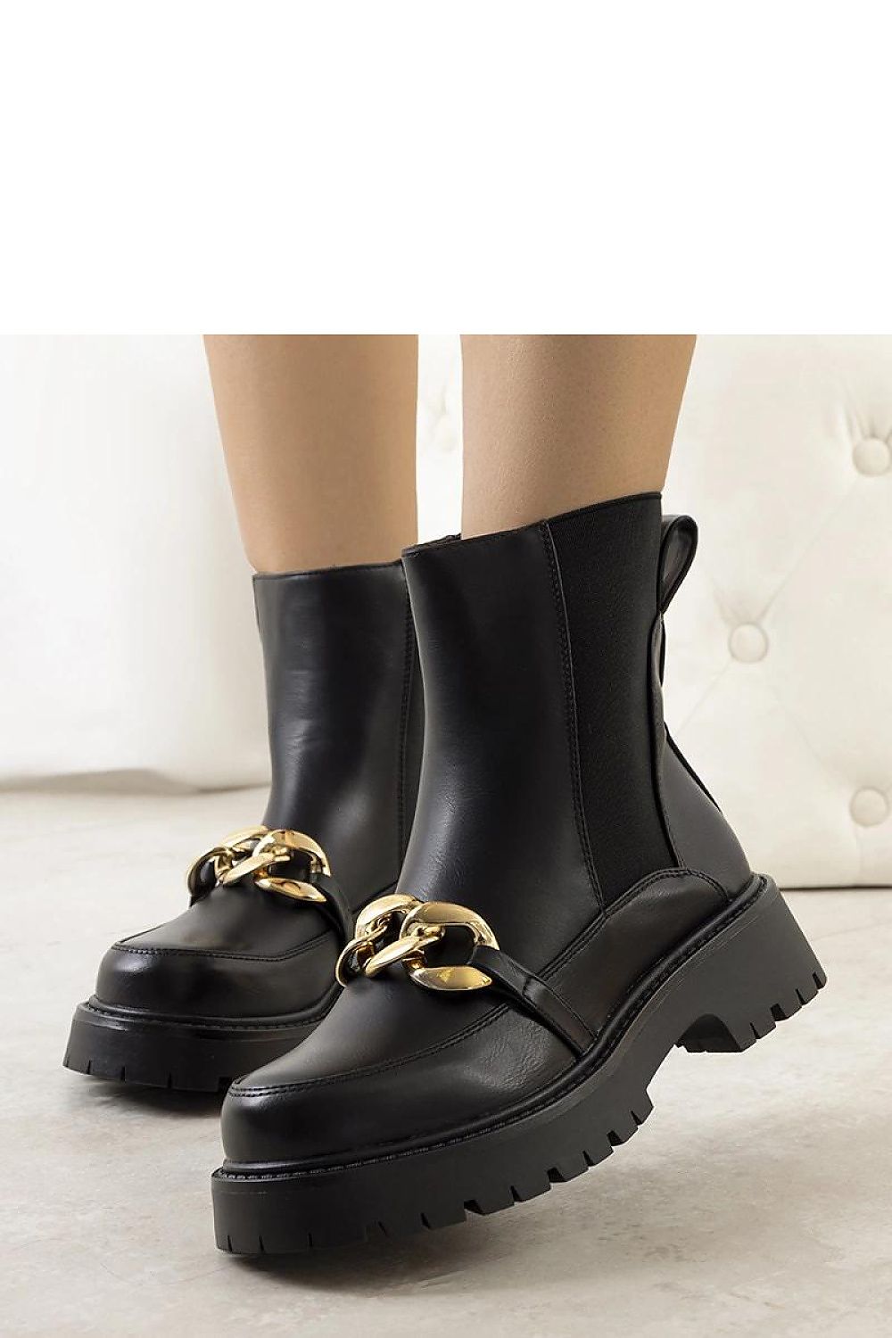 Solea luxurious black eco-leather ankle boots featuring a thick platform sole and chic chain strap, ideal for stylish autumn and winter wear.