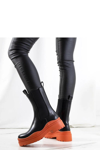 Stylish Solea black ankle boots featuring premium materials and a contemporary design with green rubber sole, ideal for a fashionable and comfortable fit.