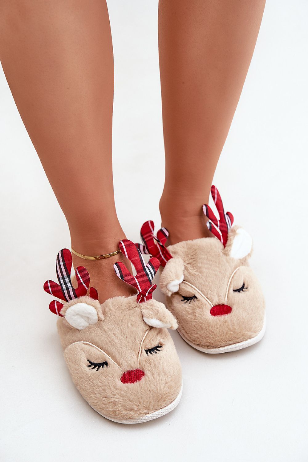 Stylish and warm luxury holiday slippers from Step in Style, featuring a plush reindeer fur for winter indulgence.