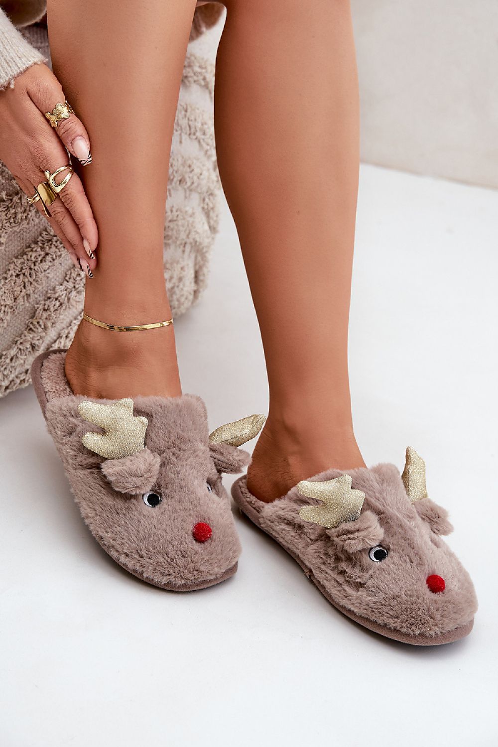 Luxury reindeer motif fur slippers for women, designed by Step in Style, showcasing a cozy winter aesthetic with premium craftsmanship.