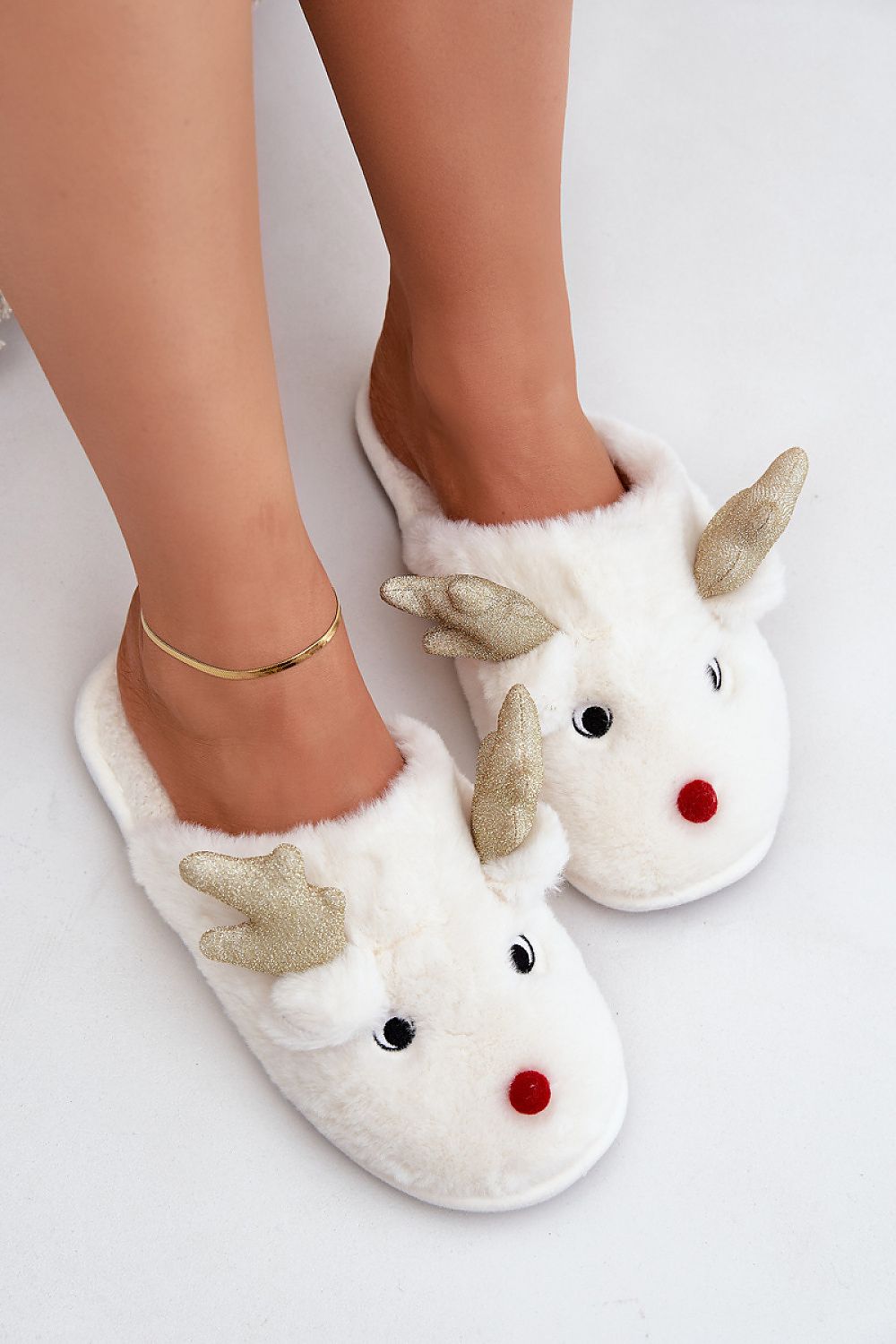 Elegant and cozy fur slippers for women featuring a charming reindeer motif, designed by Step in Style for ultimate winter comfort.