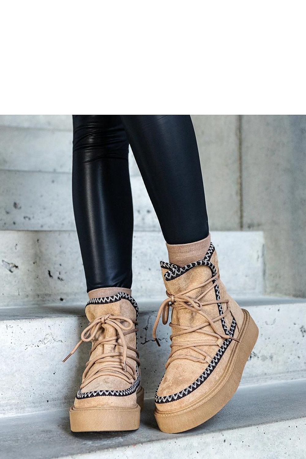 Deluxe beige snow boots on Mckenzie platform designed by Solea, featuring an embossed pattern, almond toe, and laces for winter elegance.