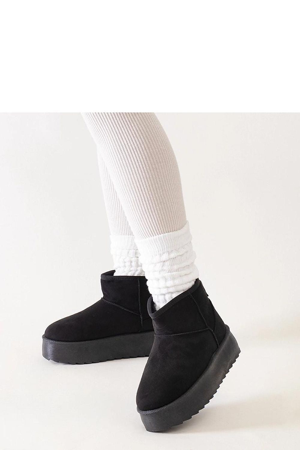 Solea Women's Black High Platform Snow Boots resting elegantly on a white background, showcasing their stylish and insulated design for winter.