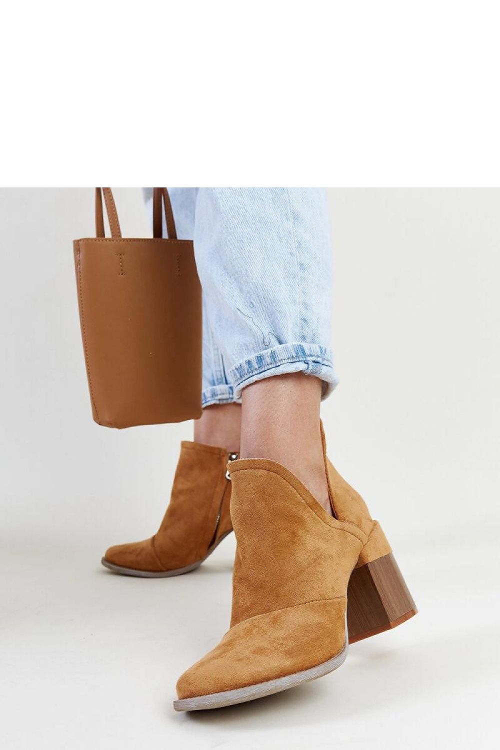 Chic synthetic leather brown ankle boots by Solea, featuring a rounded toe, high heel, and practical zipper for effortless wear.