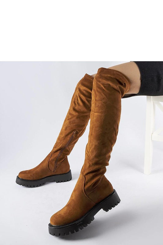 Stylish brown Kossuth thigh-high boots from Solea, crafted from eco leather with a 4cm heel, perfect for chic winter fashion.