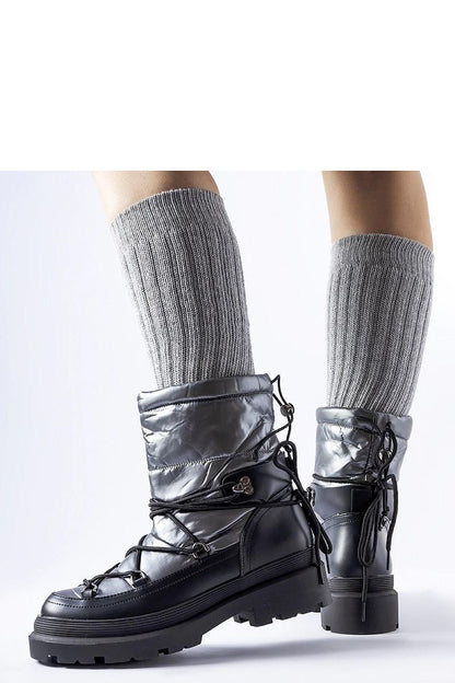 Stylish Solea Eagleville snow boots displayed on a snowy background, highlighting their chic and functional appeal for cold weather.