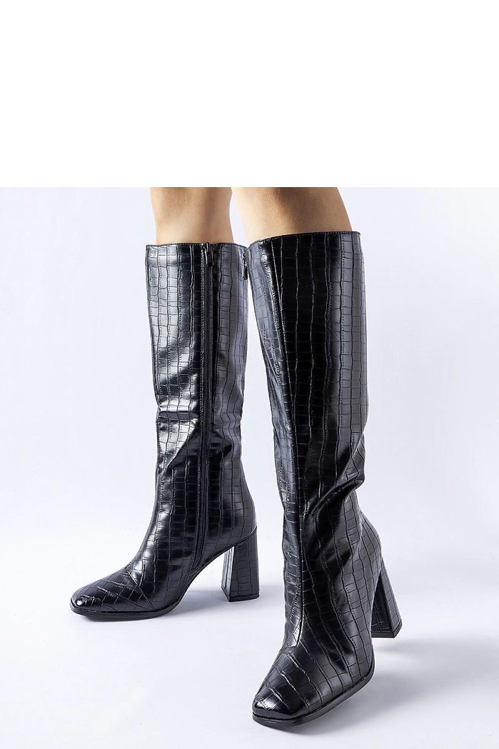 Chic Solea brown insulated heel boots showcasing premium materials and craftsmanship for sophisticated winter elegance.