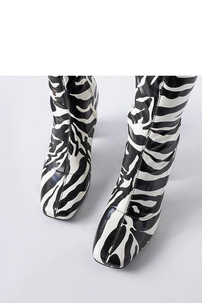 Side profile of the green Upland stiletto boots by Solea, demonstrating their sleek design and ankle-length appeal for fashionable women.