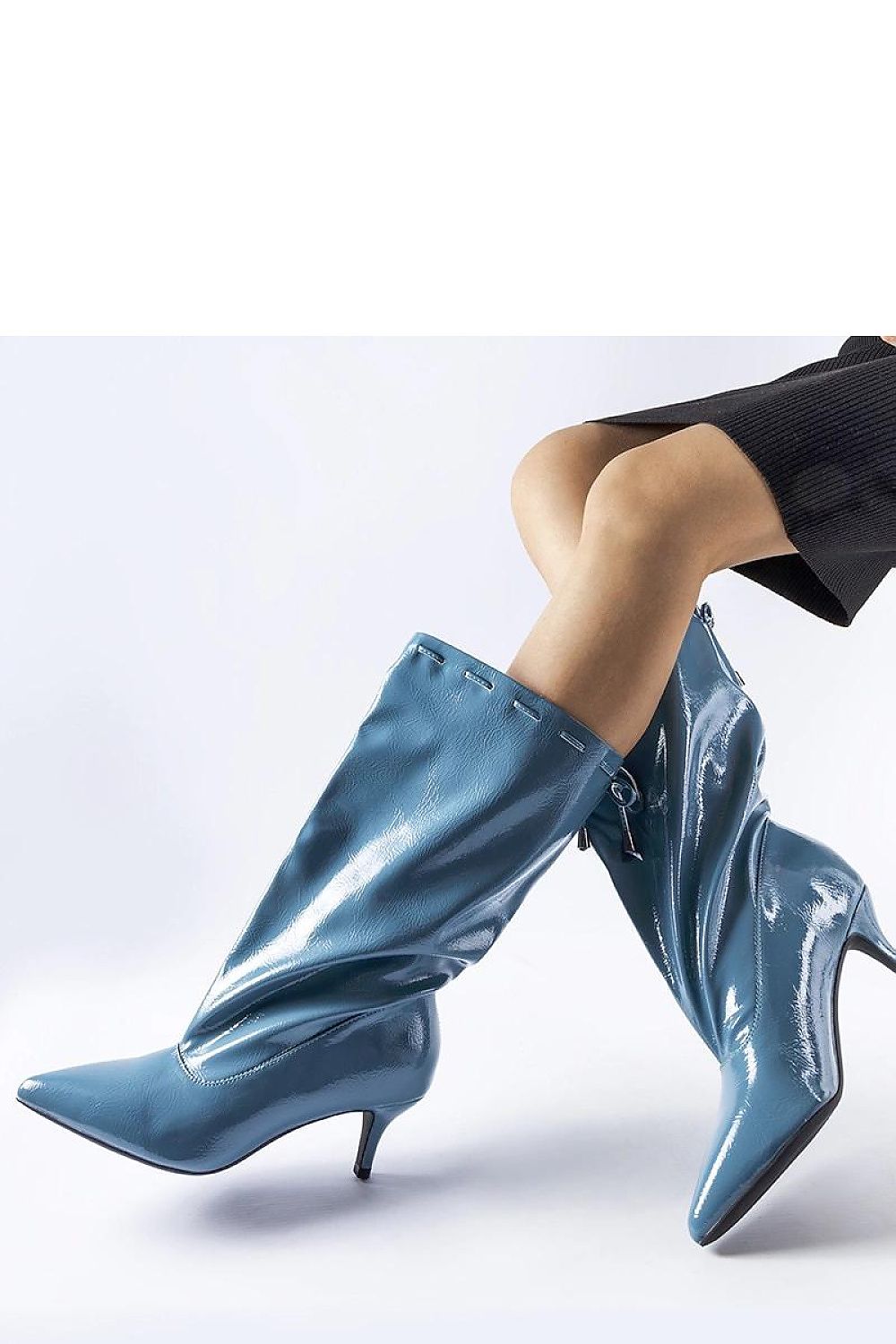 Solea's luxurious blue Clinton low stiletto boots with a 5.5 cm heel, perfect for adding elegance to autumn and winter wardrobes.