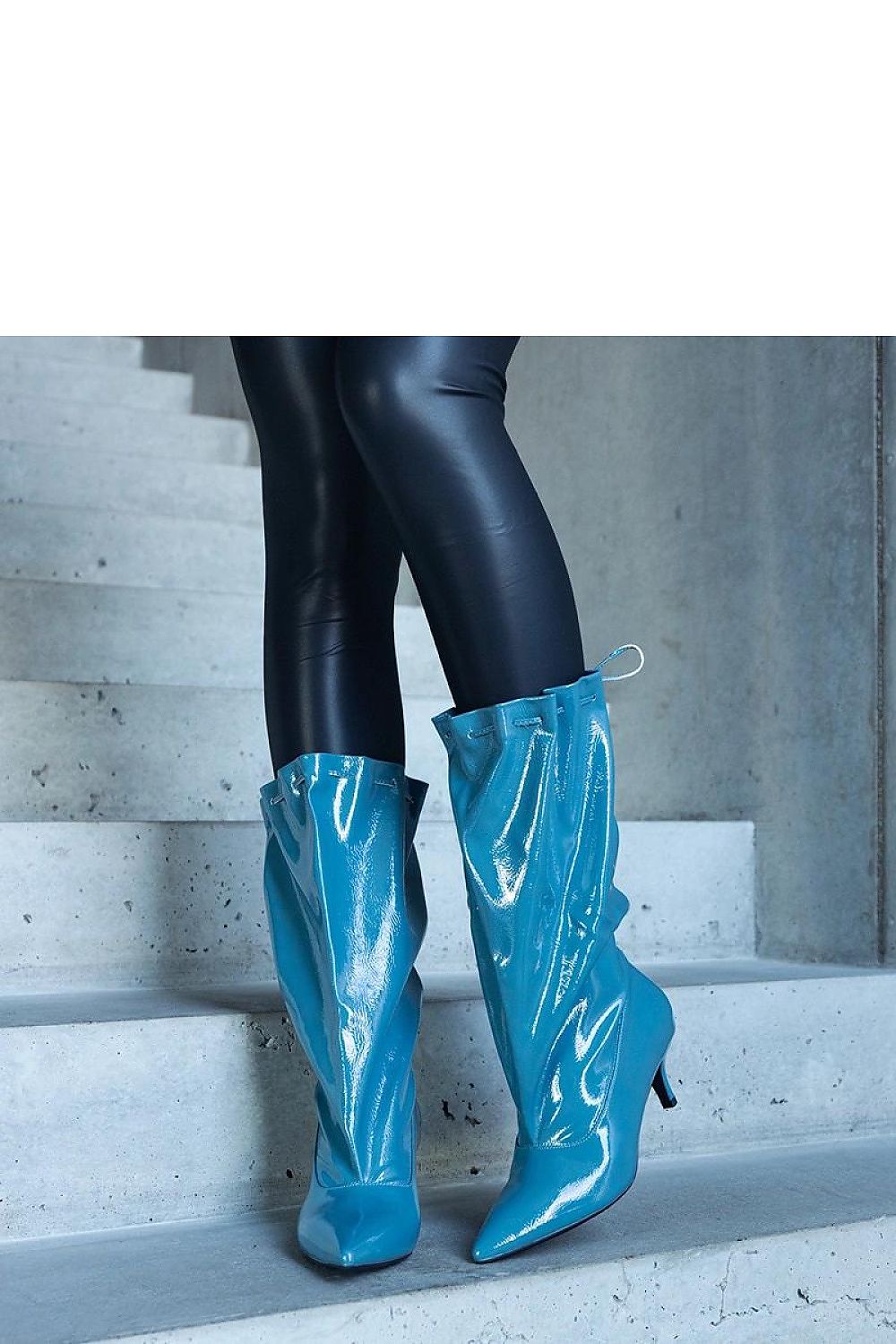 Elegant blue Clinton low stiletto boots by Solea made from eco leather, featuring a sleek pointed nose design, perfect for chic winter outfits.
