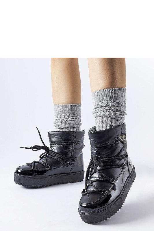 Close-up of Solea luxury black insulated snow boots, showcasing the high-quality rubber and slip-on design, perfect for cold weather.