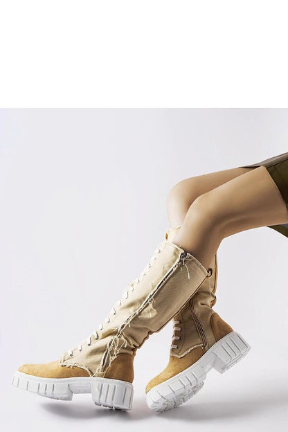 Luxury beige insulated Palmer boots by Solea with a rubber white sole, perfect for fall and winter styling.