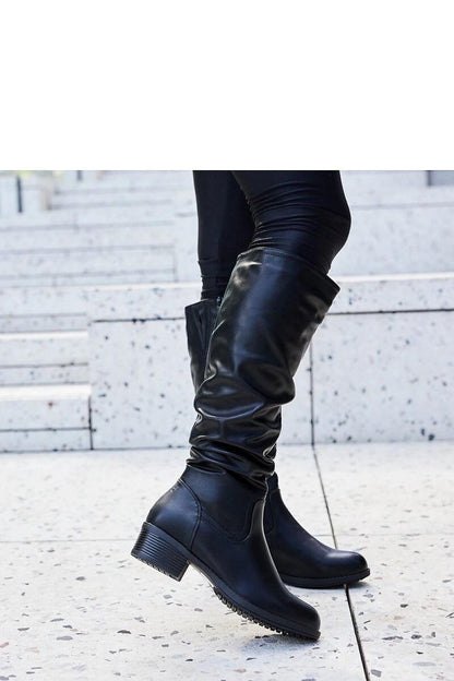 Elegant black thigh-high boots for women from Solea, crafted in weatherproof eco leather, designed for chic winter style and comfort.