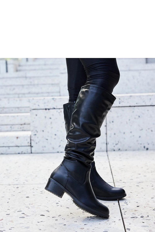 Elegant black thigh-high boots for women from Solea, crafted in weatherproof eco leather, designed for chic winter style and comfort.