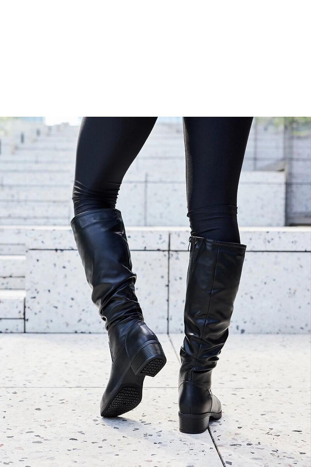 Stylish black thigh-high boots from Solea, designed for versatility with formal and casual outfits, made of durable eco leather materials.