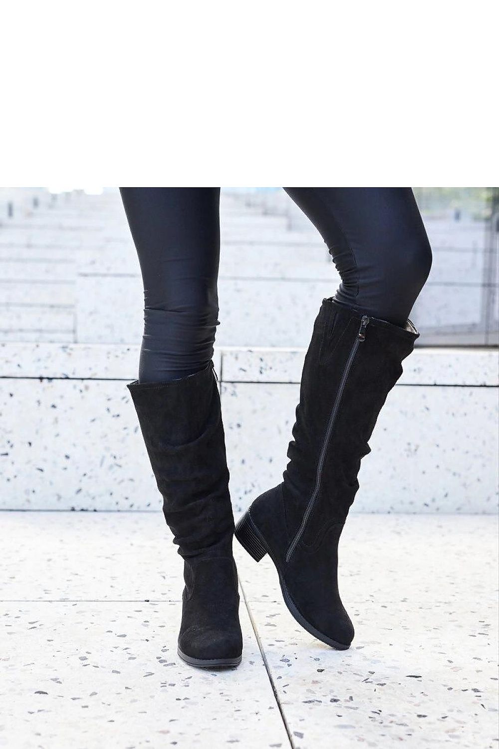 Elegant black thigh-high boots by Solea for women, crafted from weatherproof eco leather, featuring a chic almond-shaped toe and a 4 cm flat heel, ideal for stylish winter outfits.
