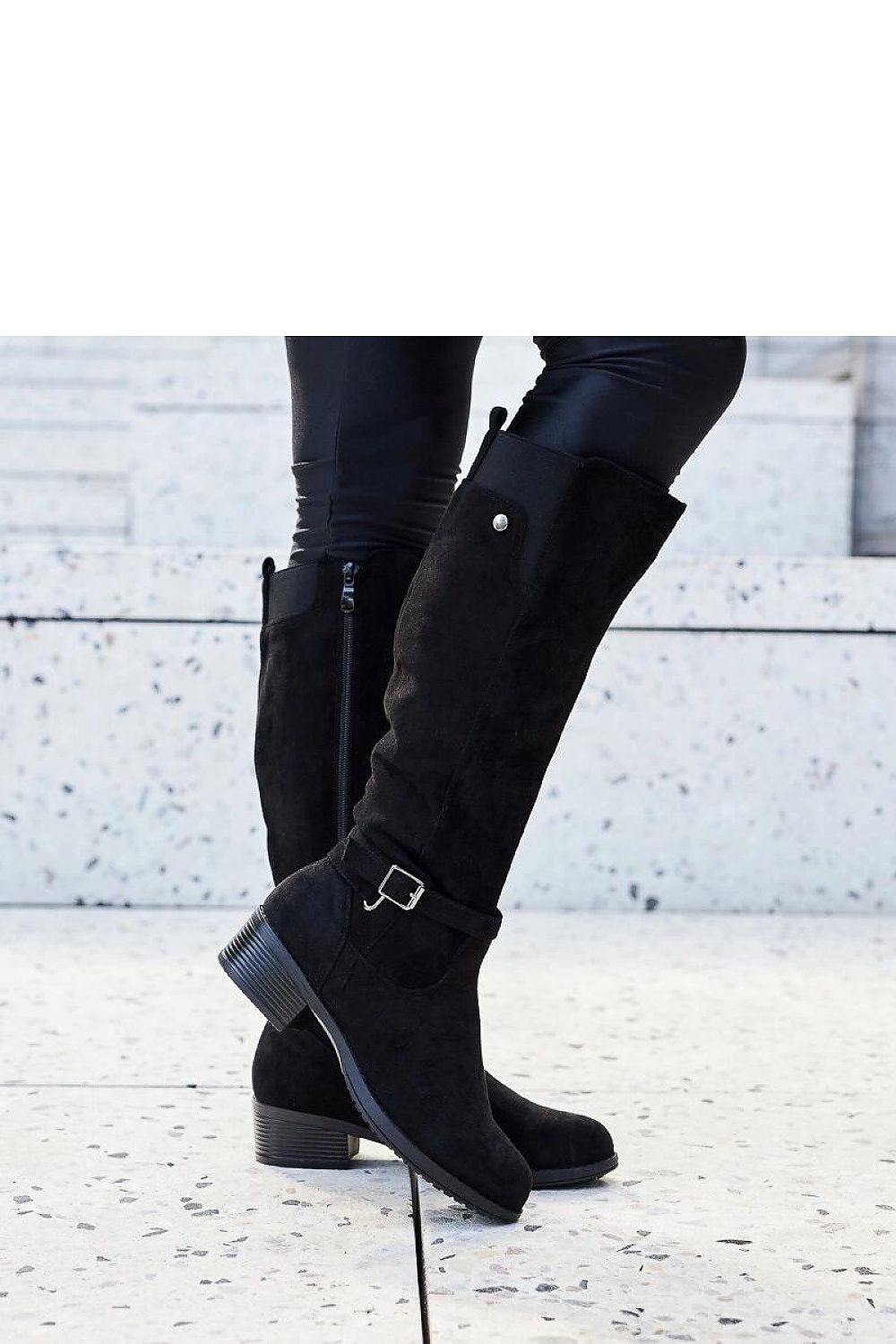 Side view of luxury black eco-suede women’s knee-high boots from Solea, featuring chic almond-shaped toes and practical side zippers for easy wear.