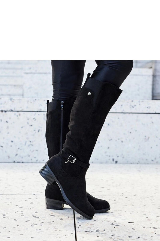 Side view of luxury black eco-suede women’s knee-high boots from Solea, featuring chic almond-shaped toes and practical side zippers for easy wear.