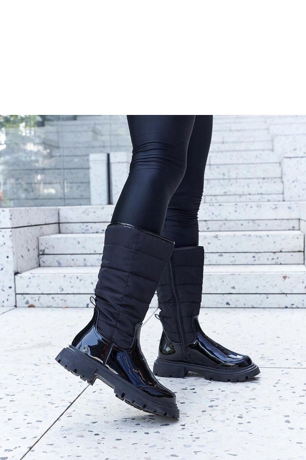 Model wearing Solea Villafranca Black Insulated Thigh-High Snow Boots, exemplifying stylish winter fashion with practicality.