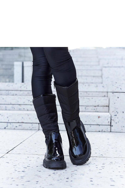 Solea Villafranca black insulated thigh-high snow boots for women, showcasing a sleek minimalist design perfect for winter fashion.