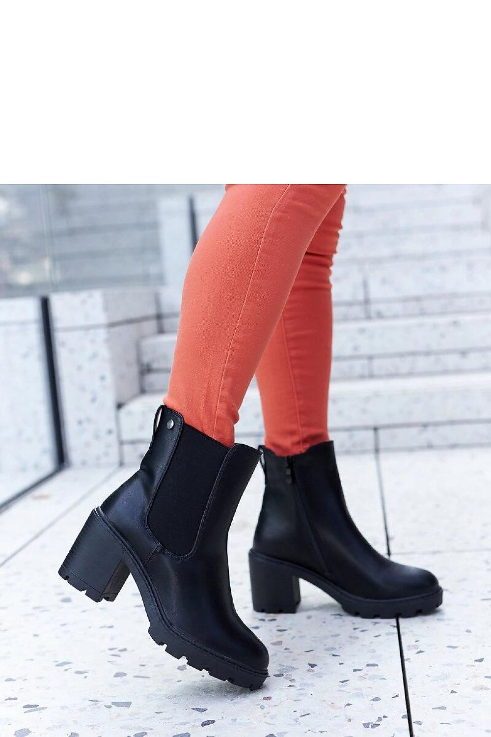 Solea black insulated stiletto heel boots styled with fashionable outfits, exhibiting their versatility and modern elegance for winter fashion.