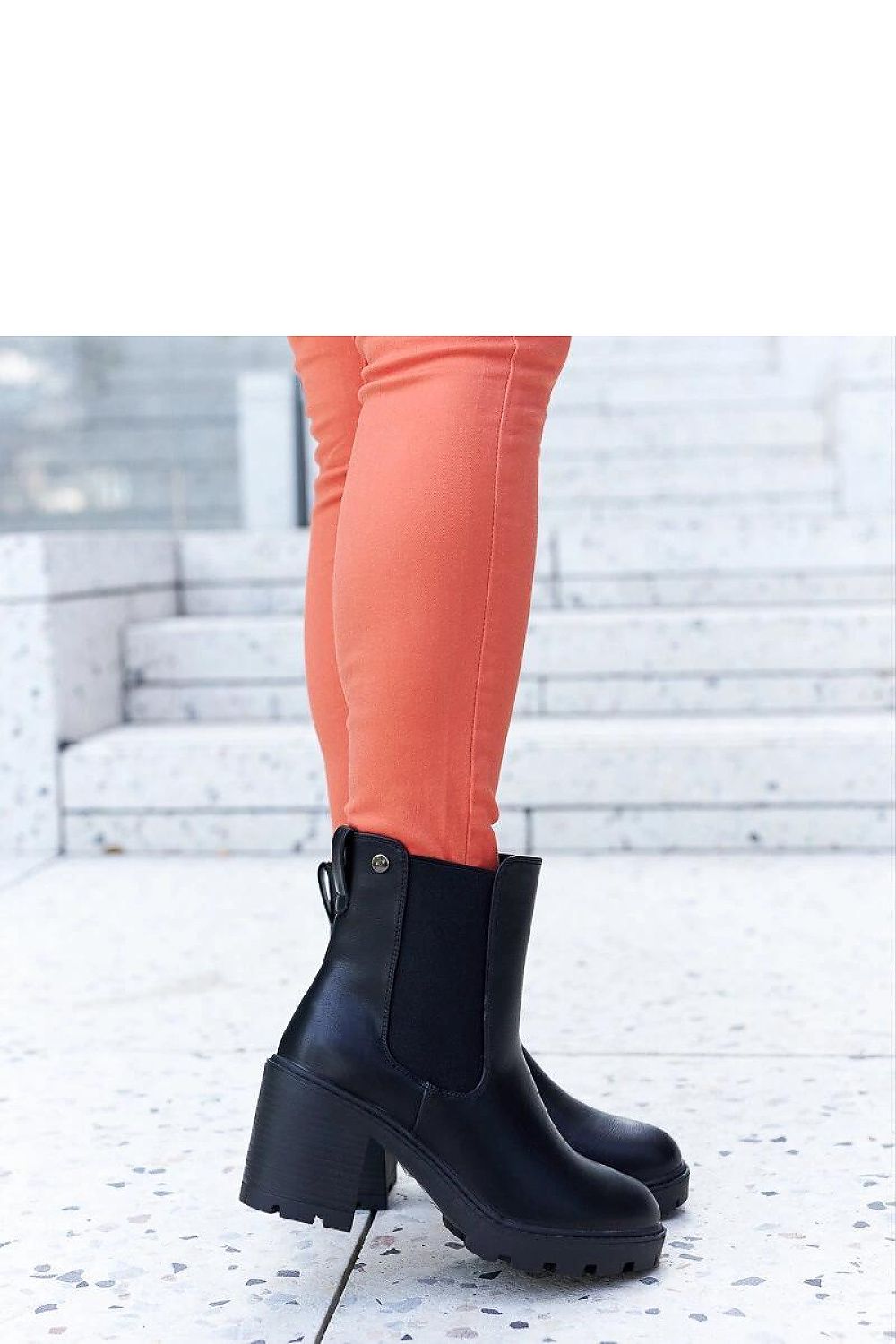 Solea Black Eco Leather Insulated Stiletto Heel Boots displayed beside stylish winter outfits, highlighting their versatility and fashion-forward design.