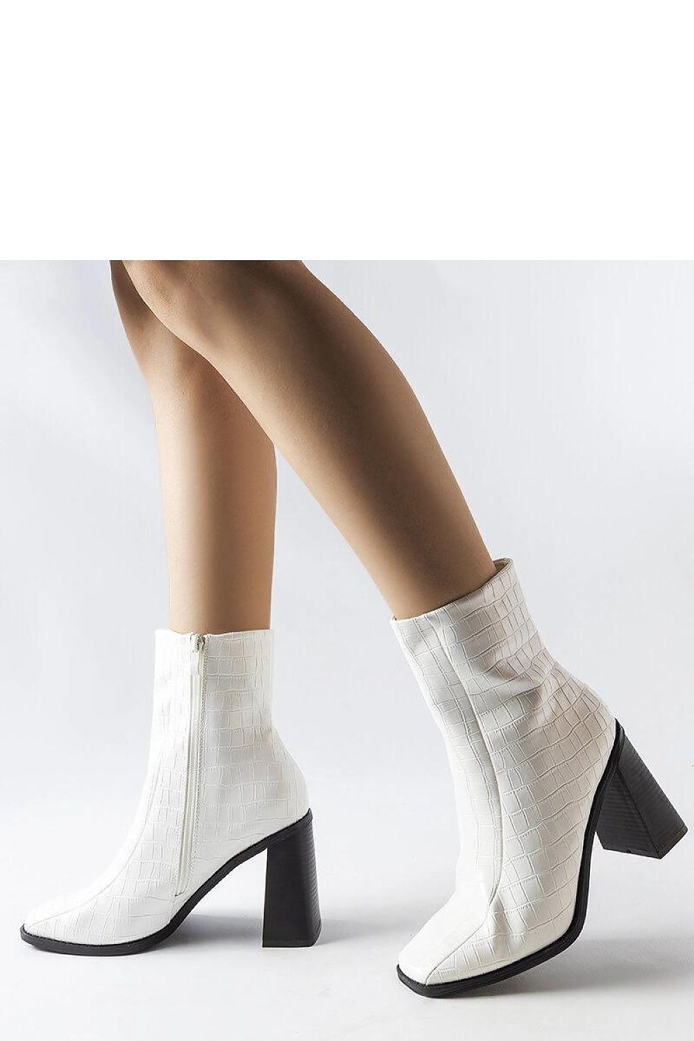 Stylish Solea ankle boots in white faux crocodile leather, designed with a comfortable 9.5cm stiletto heel for fashionable winter wear.