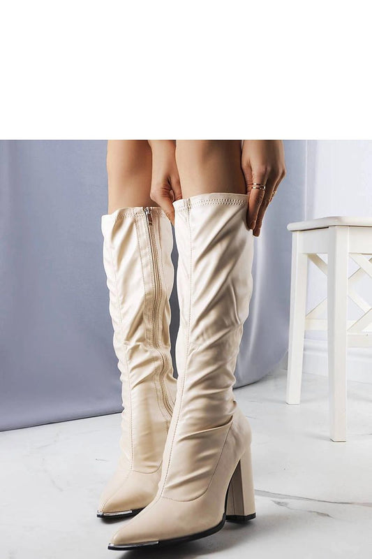 Stylish organic leather beige Velass stiletto boots showcasing a pointed toe design, ideal for enhancing leg silhouette, by Solea.