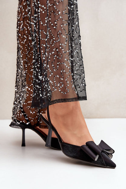 Elegant women's high heels from Step in Style, adorned with a stylish bow, ideal for evening outings, featuring a pointed toe and stiletto heel.