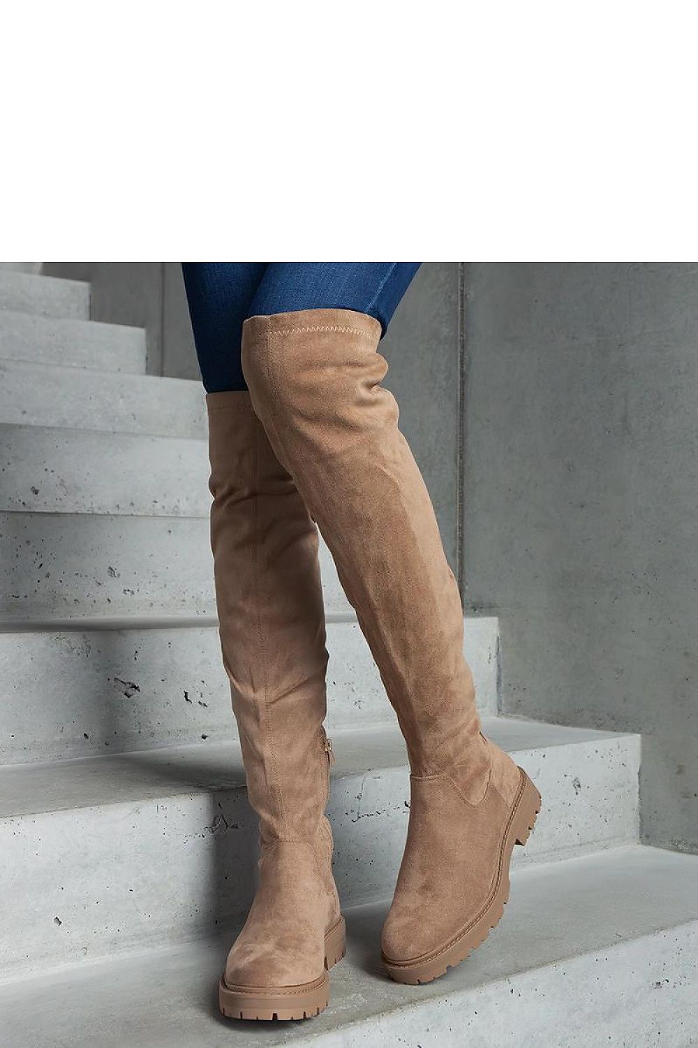 Fashion-forward Solea Black Long Thigh-High Boots styled for a chic winter look, featuring a comfortable flat sole.