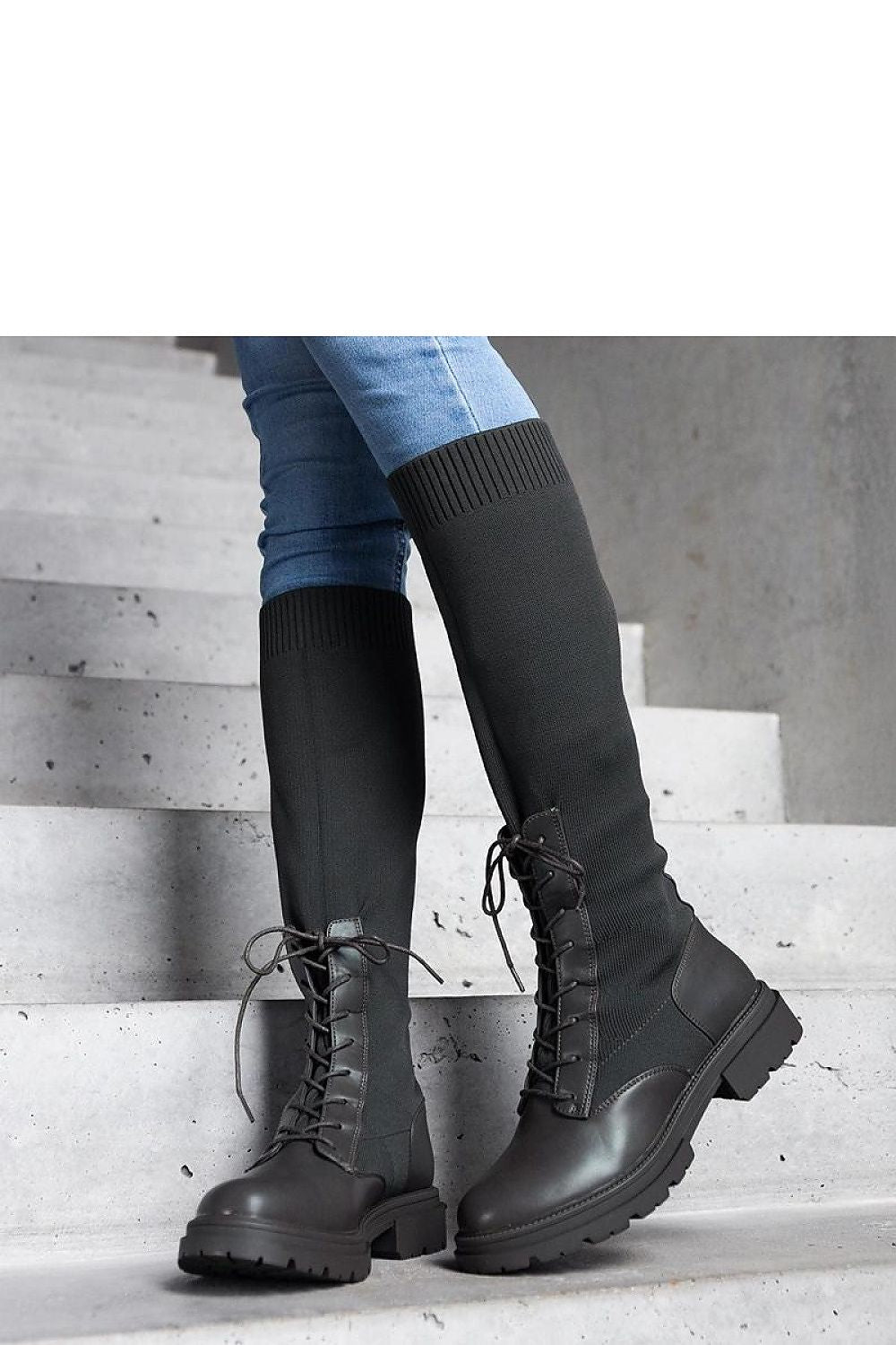 Luxury green thigh-high boots from Solea featuring a flexible fabric upper, designed for style and warmth in winter.
