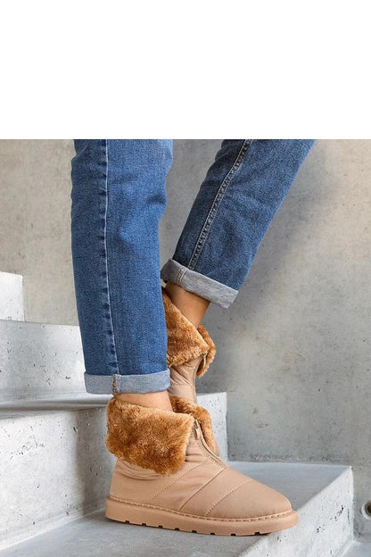 Close-up of Solea Insulated Snow Boots featuring chic beige rubber material and Edidda collar, perfect for sophisticated winter wear.