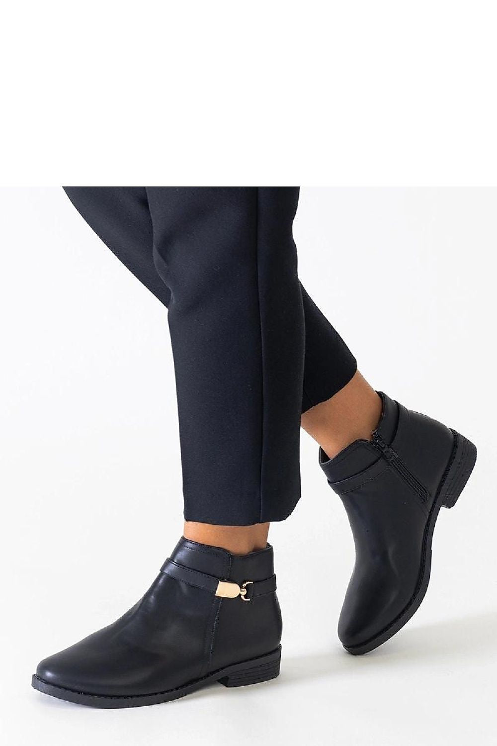 Close-up of Solea's Elegant Black Eco-Leather Ankle Boots With Gold Inserts, highlighting the intricate gold detailing and eco-friendly material.