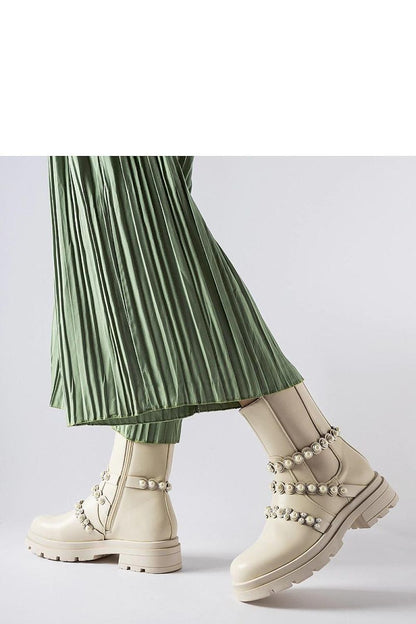 Sophisticated Beige Ankle Boots adorned with pearls from Solea, stylish and comfortable design perfect for fall and winter.