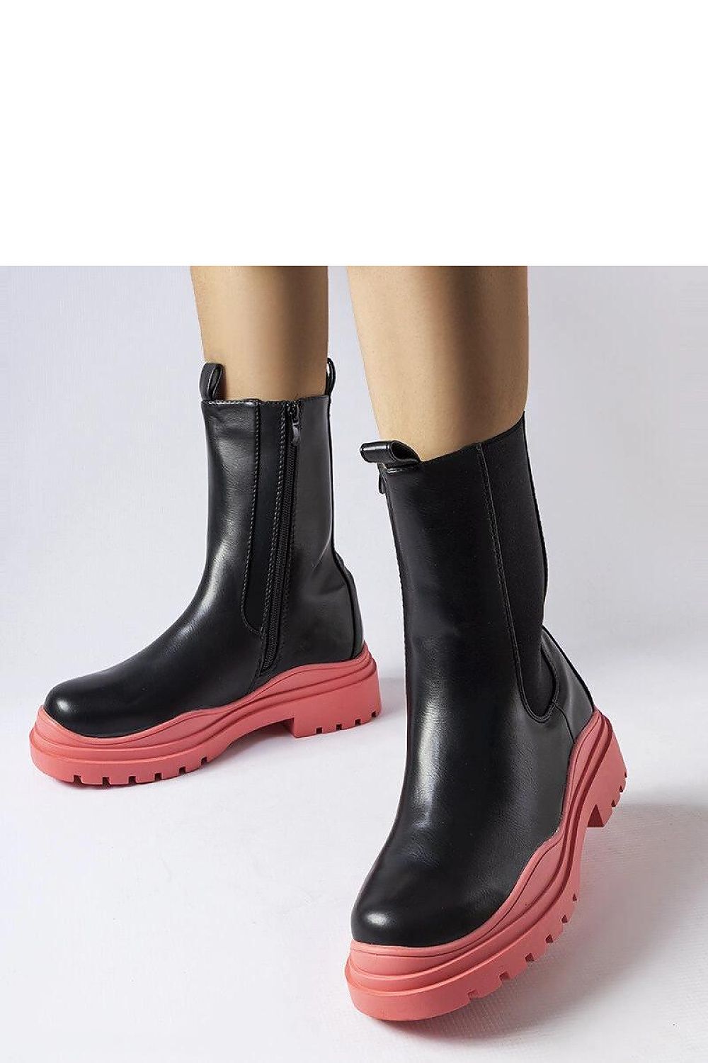 Close-up of Solea Black Ankle Boots featuring a vibrant green sole, highlighting the modern and classic design perfect for autumn-winter fashion.