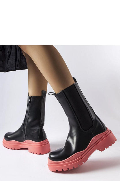 Solea Black Ankle Boots with Colourful Green Sole on a chic background, illustrating comfort with a flat heel and moisture-resistant eco-leather material.