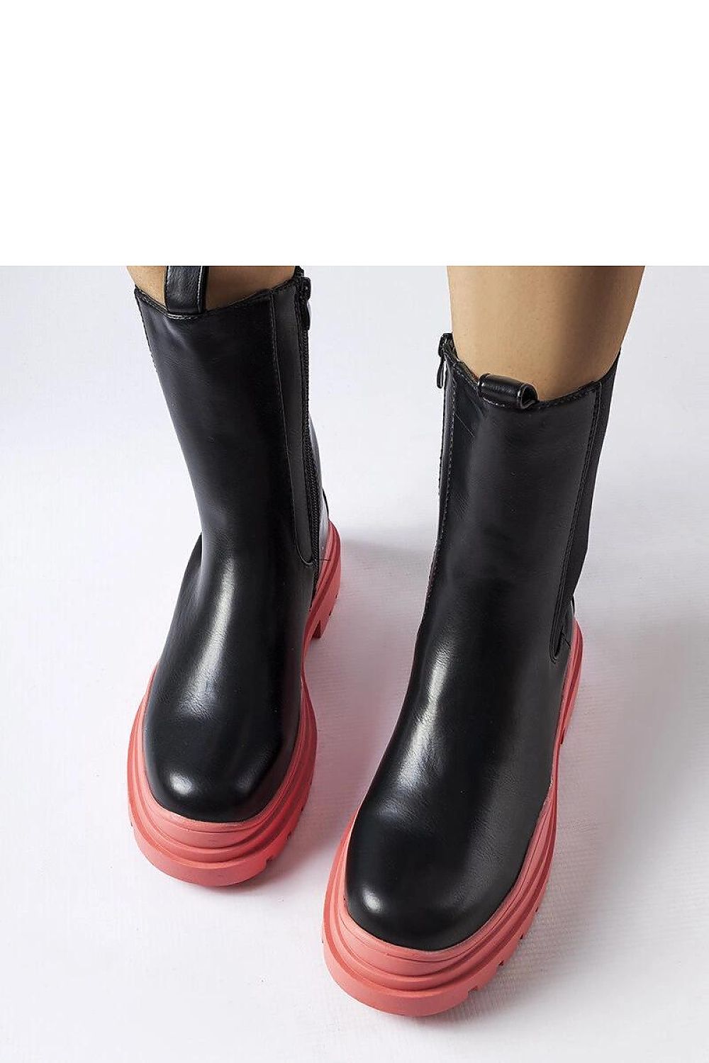 Solea Black Ankle Boots styled with chic autumn attire, perfect for city walks and evening gatherings, combining elegance and warmth.